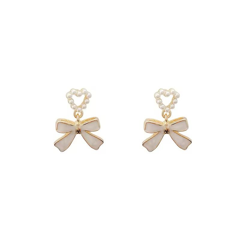 Western white bow with pearl dangler earing